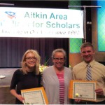 Paula Eklund Fisher presents scholarship awards to Gina Turner & Jerod Novak